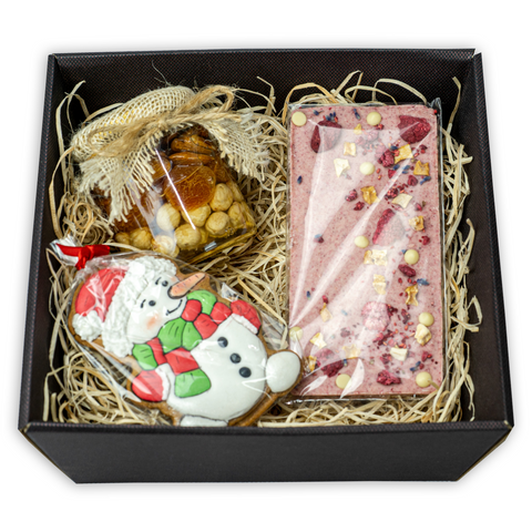 Gift set: chocolate, gingerbread, a mixture of nuts and raisins with honey